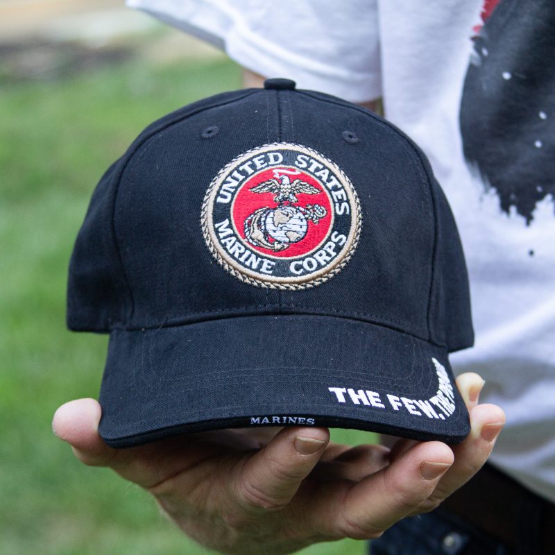 USMC emblem cap in hand